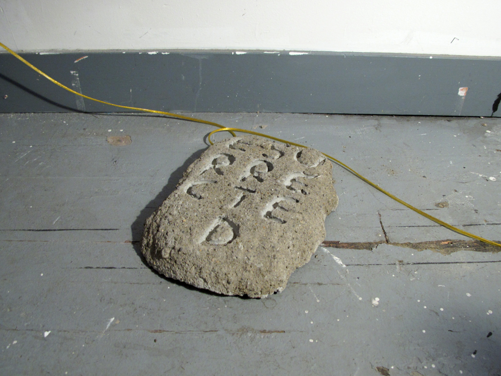 Manifesto 7, cast concrete slabs with embedded text