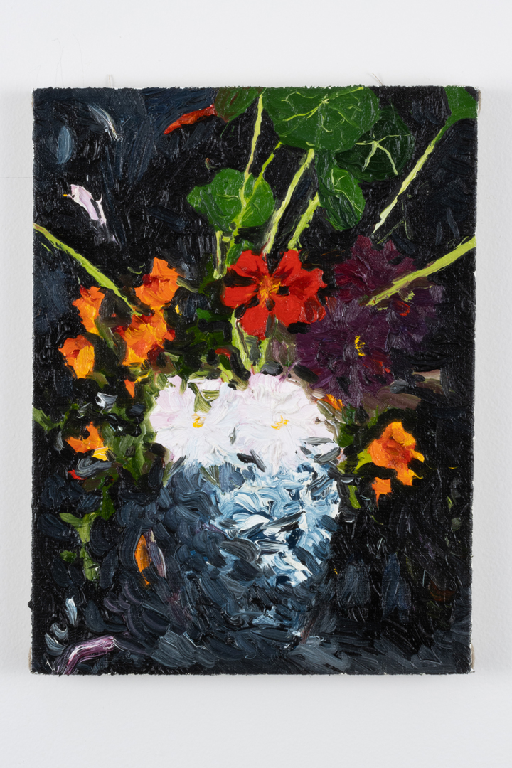 A messy oil painting of red and yellow flowers.