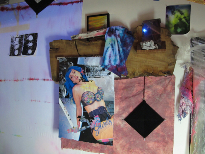 A collage of dyed fabric, a Katy Perry poster, and other elements