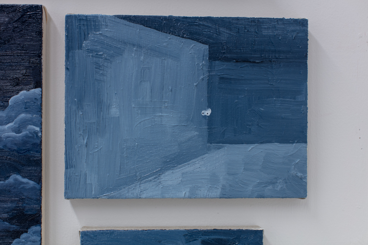 A close up view of the painting of eyes peering around the corner.