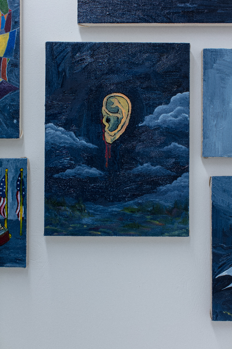 A painting of an ear floating in a dark sky, flanked by clouds.