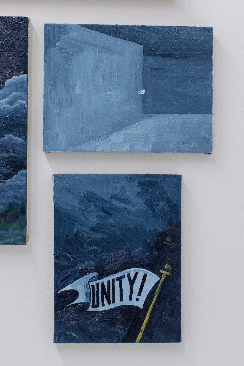 Two paintings one above the other the top painting is of cartoon eyes peering around a corner, the other of a flag that says 