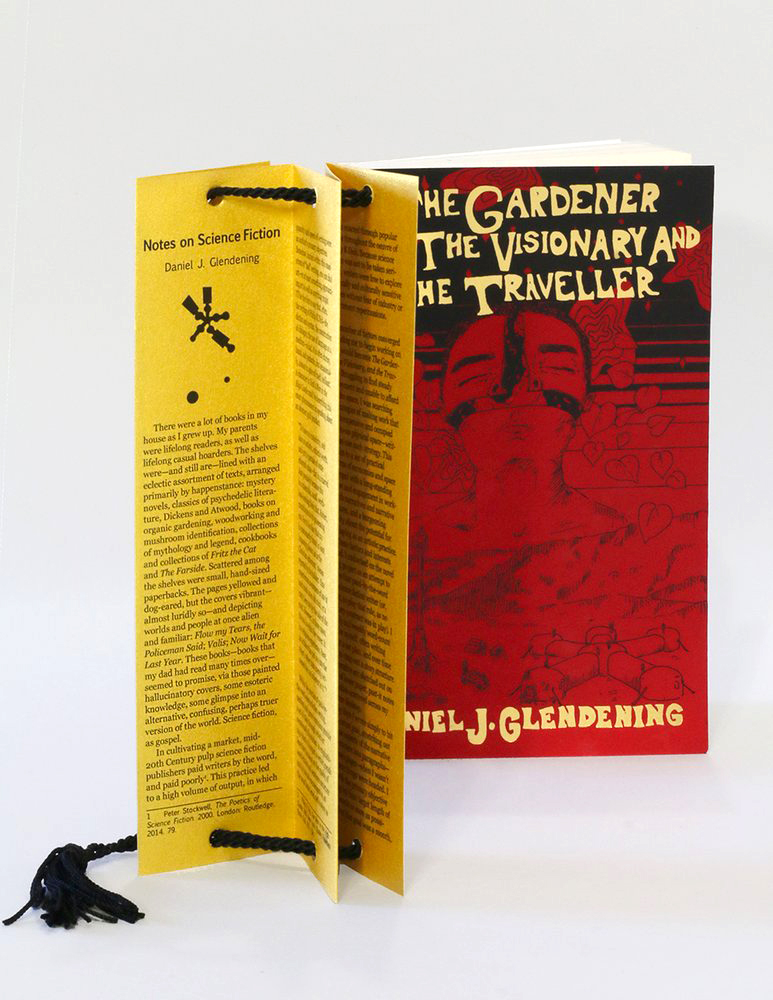 The book, again, with gold bookmark featuring an essay on science fiction